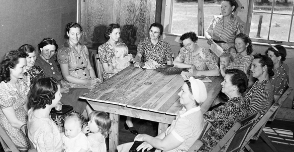 historic photo of women attending an extension meeting