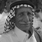 A black and white photo of a man. The photo is captured by Chris Koym.