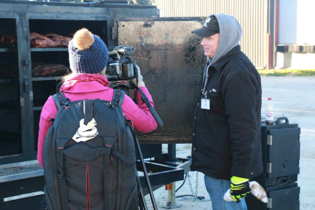 John Brotherton being interviewed by KBTX-TV reporter at Camp Brisket