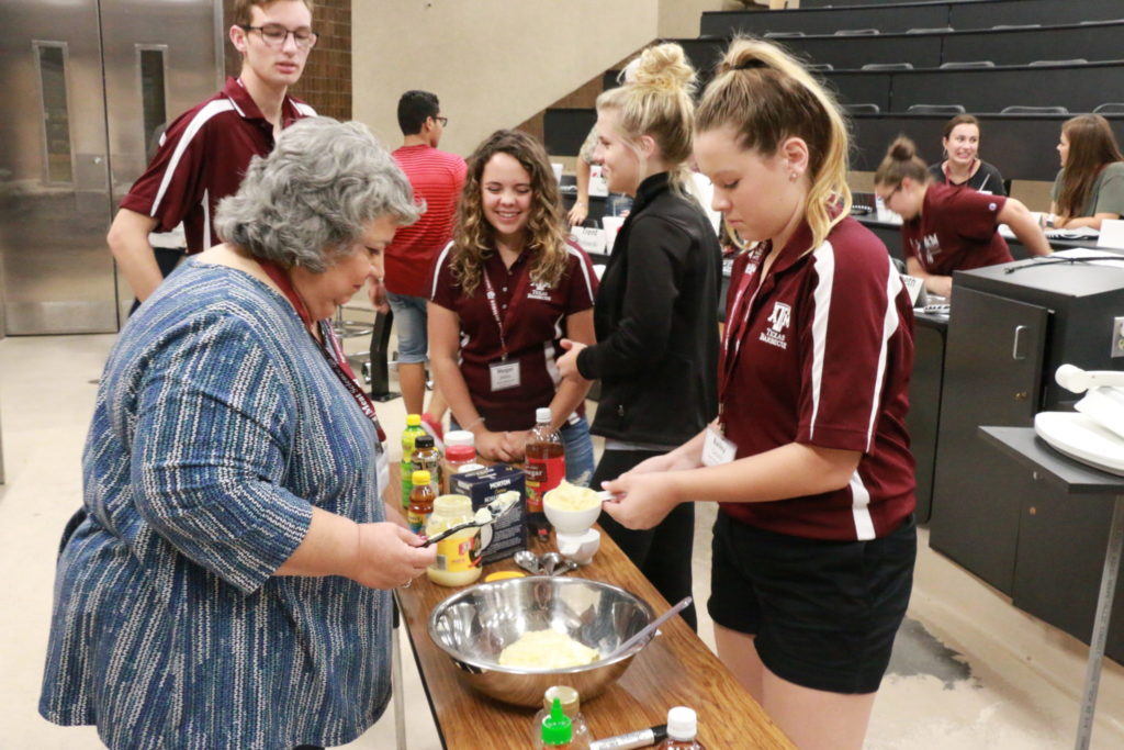 Jackie and students mixing up the Alabama White Barbecue Sauce