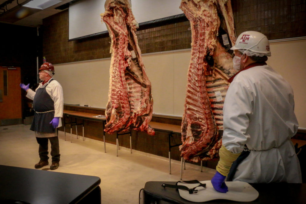 Davey and Ray talking about beef carcass grading for the Texas Barbecue Town Hall Meeting