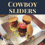 Our cowboy slider recipe loaded up with lettuce, tomatoes, and pickles on a silver platter ready to be served for your next BBQ!