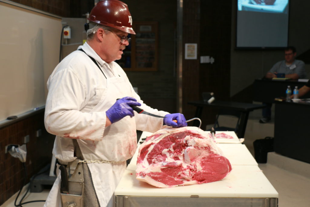 Davey Griffin boning beef round at the Center of the Plate Training sponsored by the North American Meat Institute