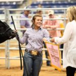 4- Participant at livestock show showing her steer