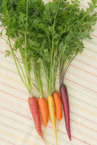 Your vegetable garden carrots are completely edible - both top and bottom of the carrot plant can be used.