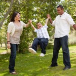 Young Family Having Fun in the Park